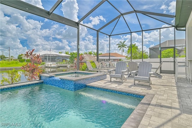 view of pool with a patio, a lanai, a water view, and an in ground hot tub