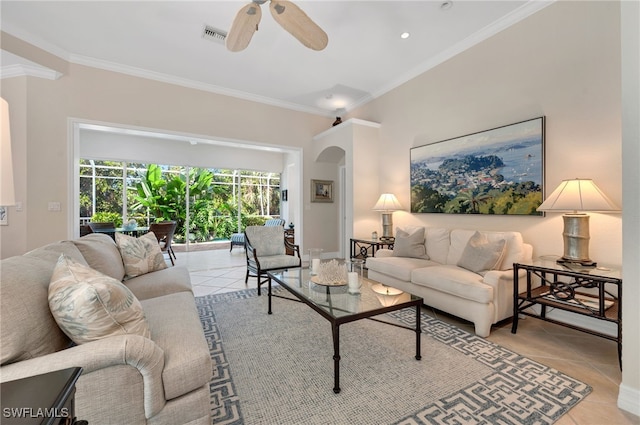 living room featuring ceiling fan, light tile patterned floors, and crown molding