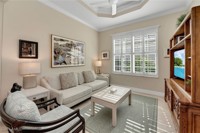 living room featuring ceiling fan, crown molding, a raised ceiling, and light tile patterned flooring