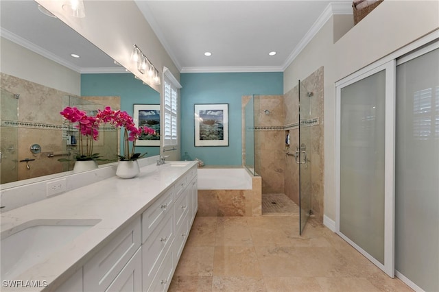 bathroom with independent shower and bath, ornamental molding, and vanity