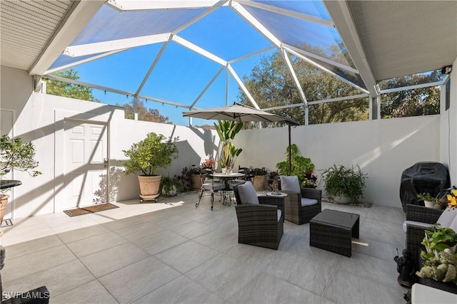 view of patio / terrace with a lanai