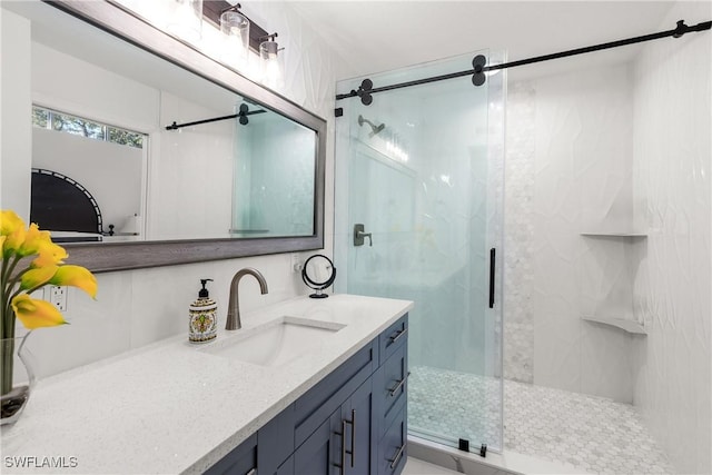 bathroom featuring vanity and an enclosed shower