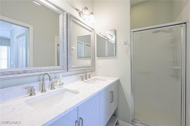 bathroom with walk in shower and vanity