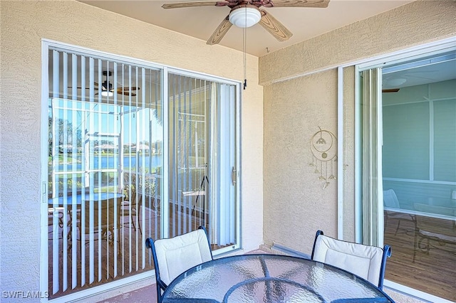 balcony featuring ceiling fan