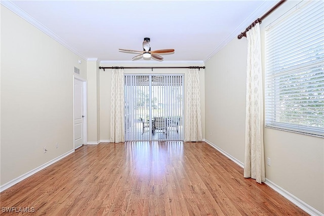 unfurnished room featuring light wood-type flooring, ceiling fan, crown molding, and plenty of natural light