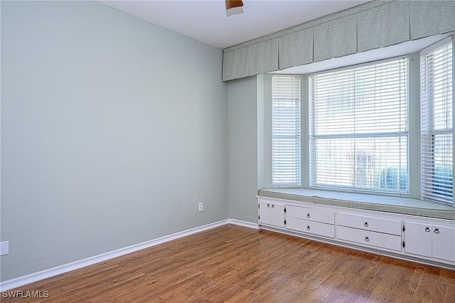 unfurnished room with light hardwood / wood-style floors