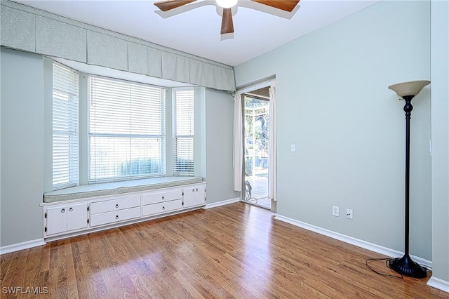 unfurnished room featuring ceiling fan and light hardwood / wood-style floors