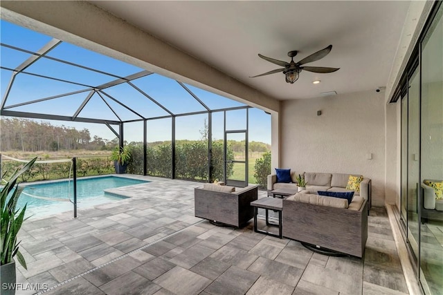 view of swimming pool with a lanai, an outdoor living space, ceiling fan, and a patio