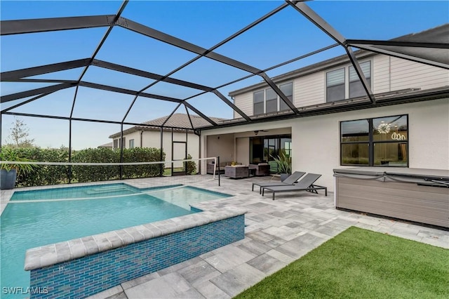 view of swimming pool featuring glass enclosure, a patio area, an outdoor hot tub, outdoor lounge area, and ceiling fan