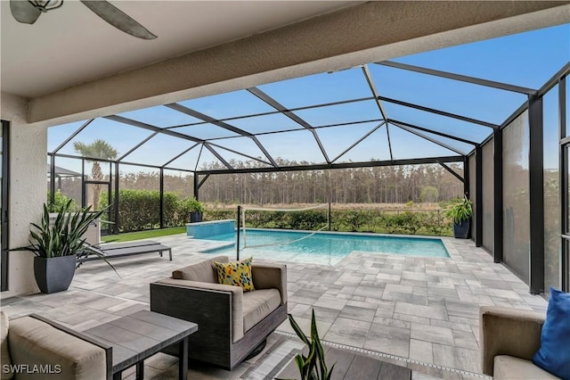 view of pool with a lanai, an outdoor hangout area, and a patio