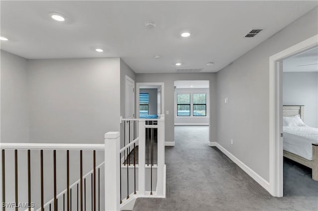 corridor with carpet floors