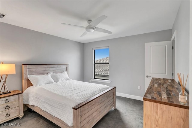 bedroom featuring ceiling fan and dark colored carpet