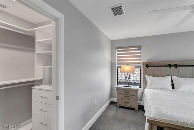 bedroom featuring ceiling fan, dark carpet, and lofted ceiling