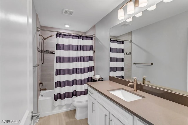 full bathroom with wood-type flooring, toilet, vanity, and shower / tub combo with curtain