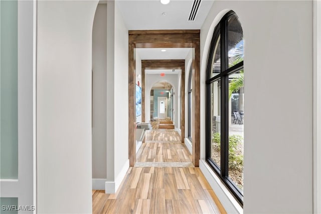 hallway with light wood-type flooring