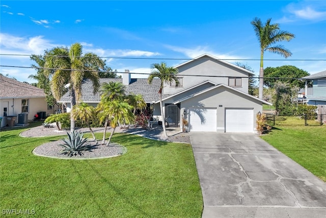 view of front of house featuring a garage, central AC unit, and a front lawn