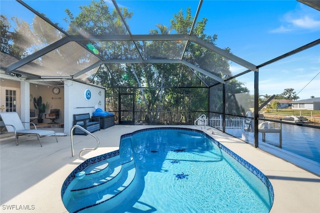 view of swimming pool with a lanai and a patio