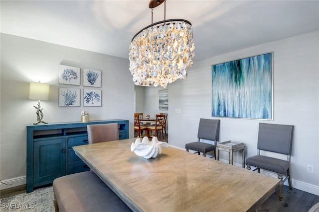 dining room with a chandelier and hardwood / wood-style flooring