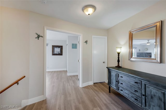 hall with light hardwood / wood-style floors