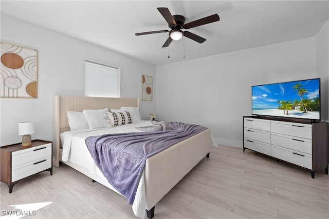 bedroom featuring ceiling fan and light hardwood / wood-style flooring