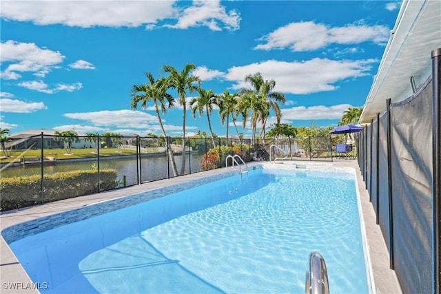 view of pool with a water view