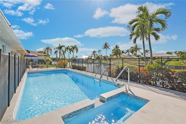 view of swimming pool featuring an in ground hot tub and a water view