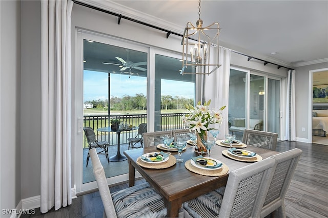 dining room featuring crown molding, dark hardwood / wood-style flooring, and ceiling fan with notable chandelier