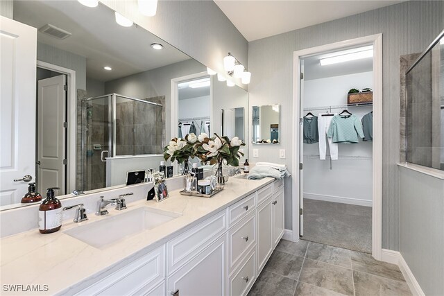 bathroom with vanity, tile patterned floors, and an enclosed shower