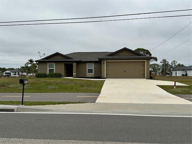 view of front facade featuring a front yard and a garage