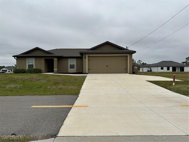 ranch-style home featuring a front yard and a garage