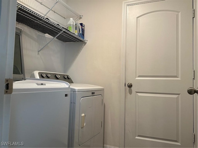 laundry area with separate washer and dryer