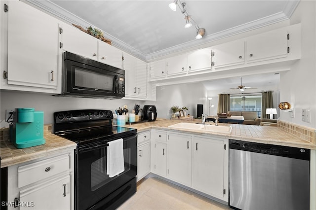 kitchen with black appliances, white cabinets, sink, ceiling fan, and ornamental molding