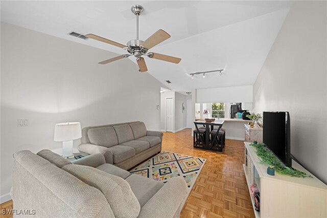 living room with light parquet flooring, lofted ceiling, and ceiling fan