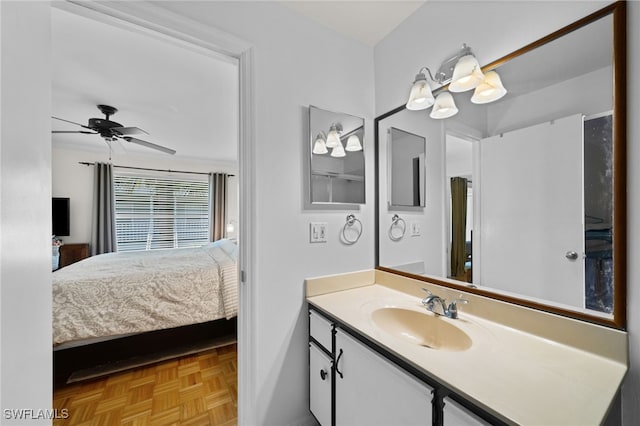 bathroom featuring parquet floors, ceiling fan, and vanity