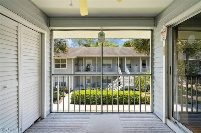 exterior space featuring carpet and wood walls