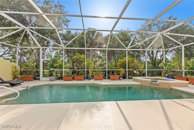 view of swimming pool with a lanai, an in ground hot tub, and a patio