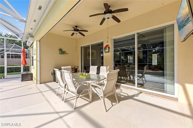 view of patio / terrace with ceiling fan and glass enclosure