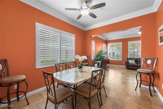 dining area featuring ceiling fan, light tile patterned flooring, and crown molding