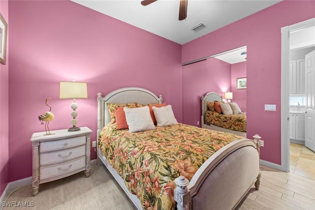 bedroom with ceiling fan and light hardwood / wood-style flooring