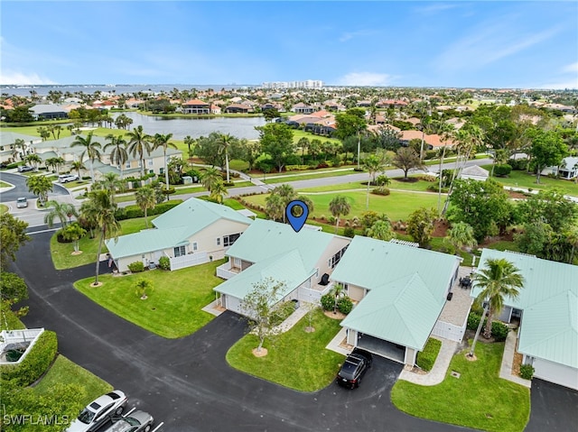 birds eye view of property with a water view