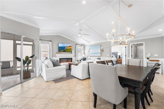 tiled dining space featuring ceiling fan with notable chandelier, ornamental molding, and vaulted ceiling with beams