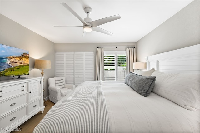 bedroom with ceiling fan and dark hardwood / wood-style flooring