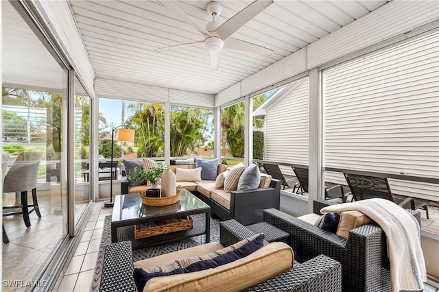 sunroom featuring ceiling fan