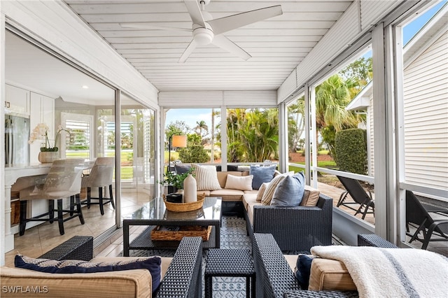 sunroom / solarium with ceiling fan and plenty of natural light