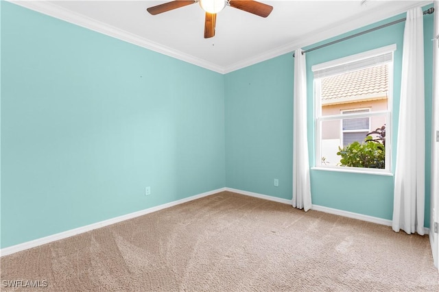 unfurnished room with carpet flooring, ceiling fan, a healthy amount of sunlight, and crown molding