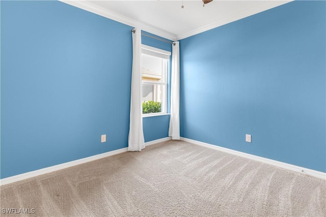 carpeted spare room with ornamental molding