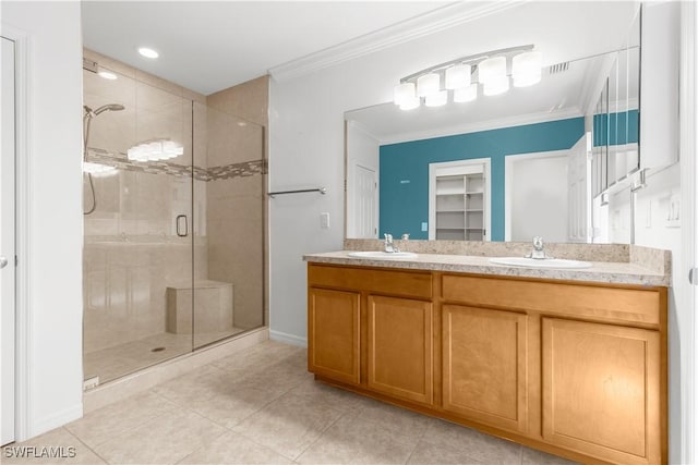 bathroom with crown molding, tile patterned flooring, vanity, and walk in shower