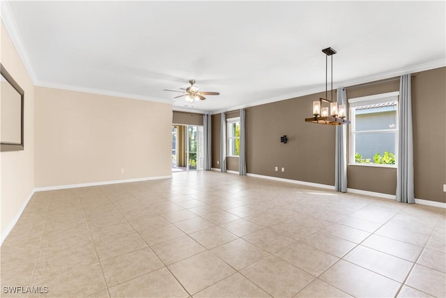 tiled empty room featuring ceiling fan with notable chandelier and ornamental molding