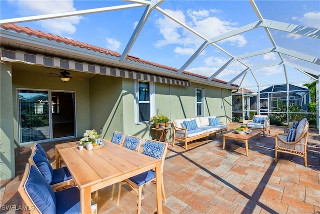 view of patio / terrace featuring an outdoor living space and glass enclosure