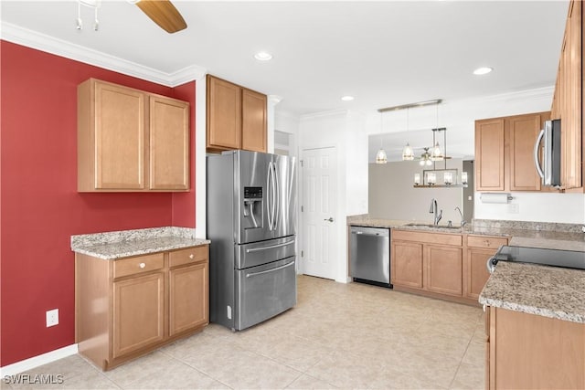 kitchen featuring ceiling fan, sink, crown molding, decorative light fixtures, and appliances with stainless steel finishes